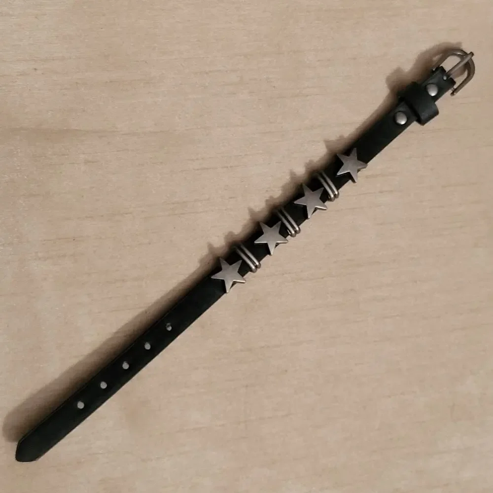Star charm black synthetic leather bracelet